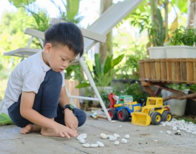 Child playing alone outside