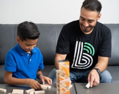 Big Brother and Little Brother playing jenga together