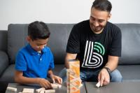 Big Brother and Little Brother playing jenga together